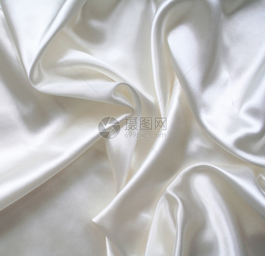 平滑优雅的白色丝绸作为背景生产衣服纺织品材料海浪折痕奢华新娘涟漪婚礼图片
