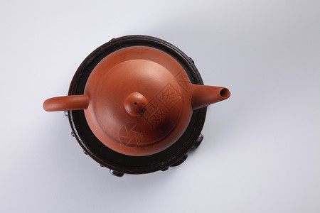 东方茶壶传统工艺陶瓷阴影食物文化陶器制品艺术棕色背景图片