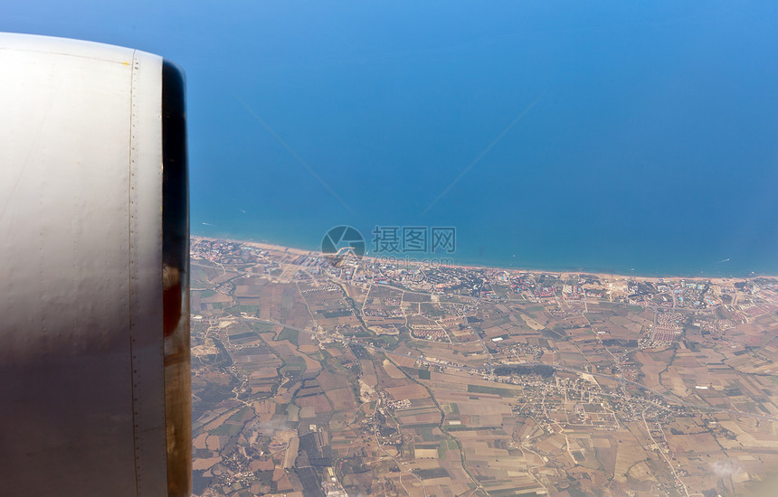 查看飞机的左舷洞旅行太阳海洋飞行高度海浪空气天空场景翅膀图片
