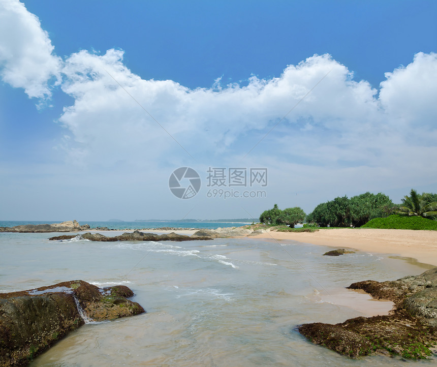 海洋海岸海浪中的石头支撑岩石天空蓝色反射风景海岸线海景日落海滩图片