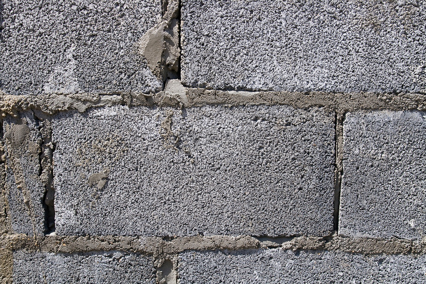 正在修建的隔离墙材料砖墙石工石头房子石匠墙纸水泥白色图片