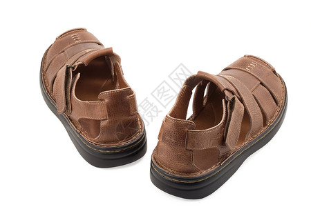沙山凉鞋鞋类靴子皮革棕色背景图片