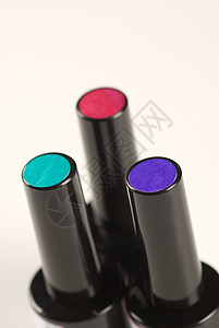 指甲油化妆品身体瓶子魅力美甲绿色护理保养指甲紫色背景图片