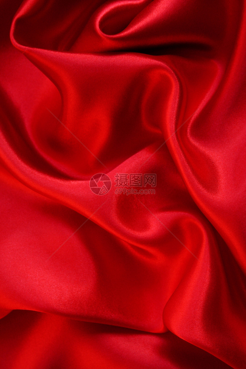 平滑的红丝绸背景织物粉色窗帘红色投标纺织品曲线奢华柔软度布料图片