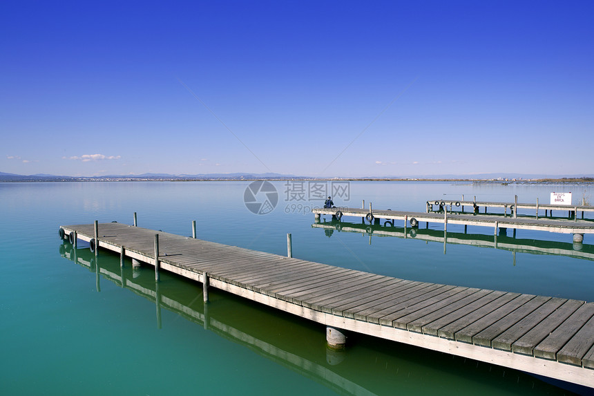 西班牙阿尔布费拉巴伦西亚湖湿地旅行海岸假期地平线反射社区蓝色码头木头天空图片