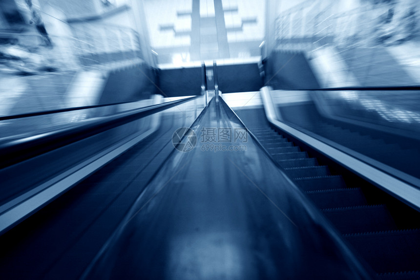 模糊的扶梯地面金属自动扶梯门厅购物中心速度蓝色楼梯银行人群图片