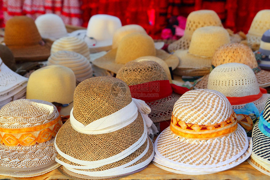 市场手工艺商店的帽子安排店铺稻草销售工艺纪念品织物手工文化工匠配饰图片