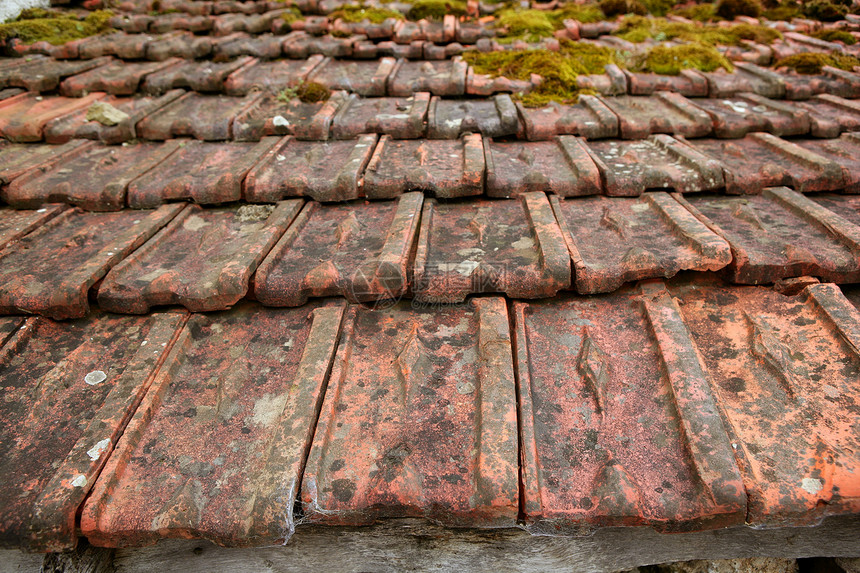 屋顶泥瓷砖的建筑板材料建筑黏土房子建造马赛克建筑学古董制品橙子图片