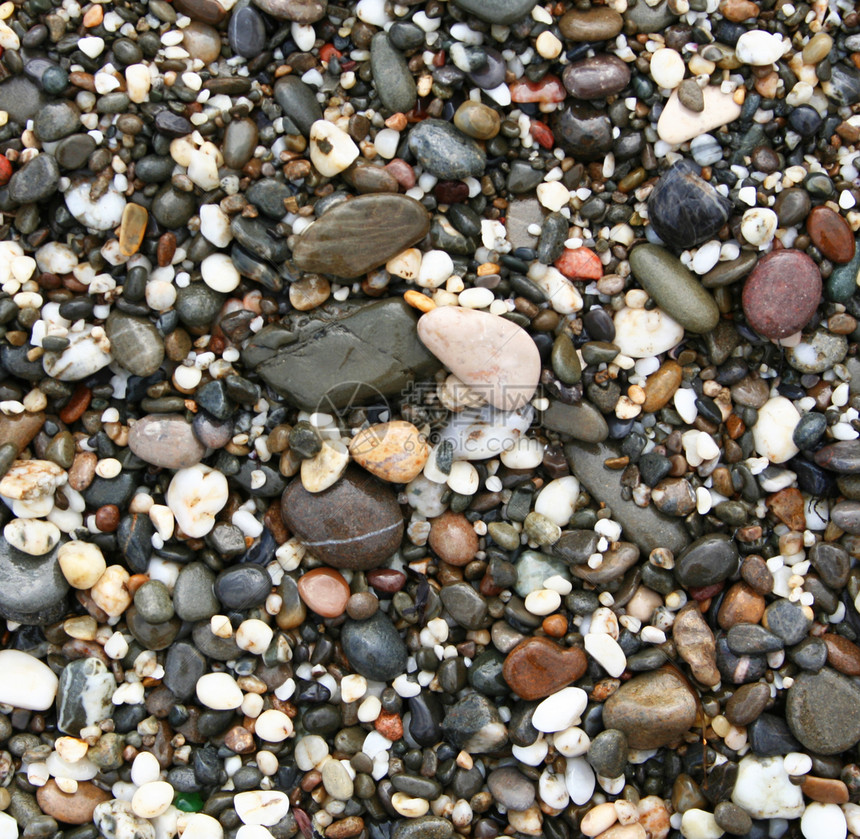 海滩上多彩的石头土地橙子材料地面温泉墙纸土块环境岩石蓝色图片