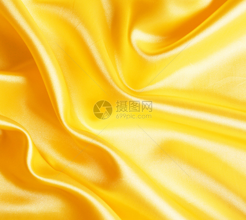 平滑优雅的金金丝绸涟漪丝绸折痕纺织品织物投标黄色曲线海浪材料图片