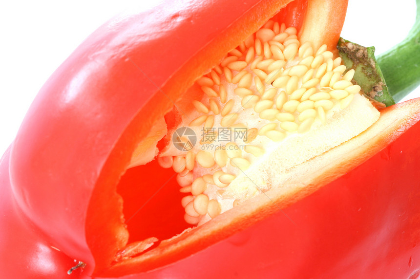 白色背景上的红色红豹在内部切开种子蔬菜食物图片