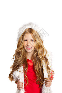 带着圣诞节冬冬白色毛皮的小女孩帽子头发快乐女儿手势女性金发童年女孩外套背景图片