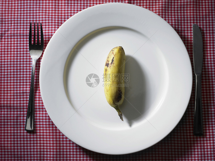 香蕉在盘子上热带甜点水果刀具黄色白色皮肤食物味道肉质图片
