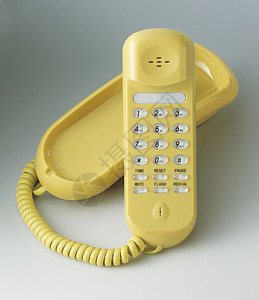 黄电话听筒拨号风格背景纯色塑料复兴电缆颜色黄色背景图片