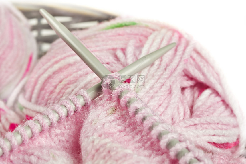 编织粉红色的婴儿衣衫 - 缝线和针头图片