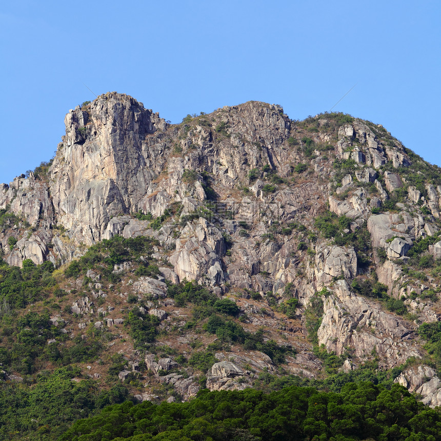 狮子石 香港精神的象征城市市中心头脑岩石地标天空爬坡白色晴天绿色图片