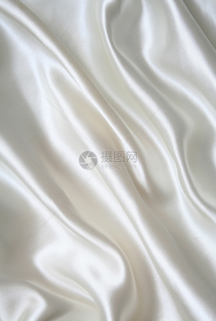 平滑优雅的白色丝绸作为背景奢华涟漪布料新娘海浪折痕婚礼材料投标纺织品图片