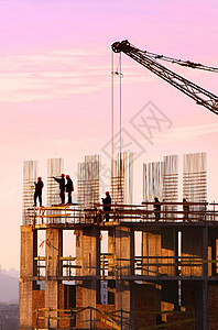 建筑工人的轮光图安全工作承包商工程脚手架力量橙子栏杆生长住房背景图片