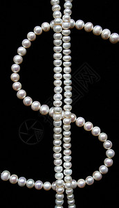 黑天鹅绒上的白珍珠折痕奢华布料寝具涟漪丝绸珍珠材料新娘版税背景图片
