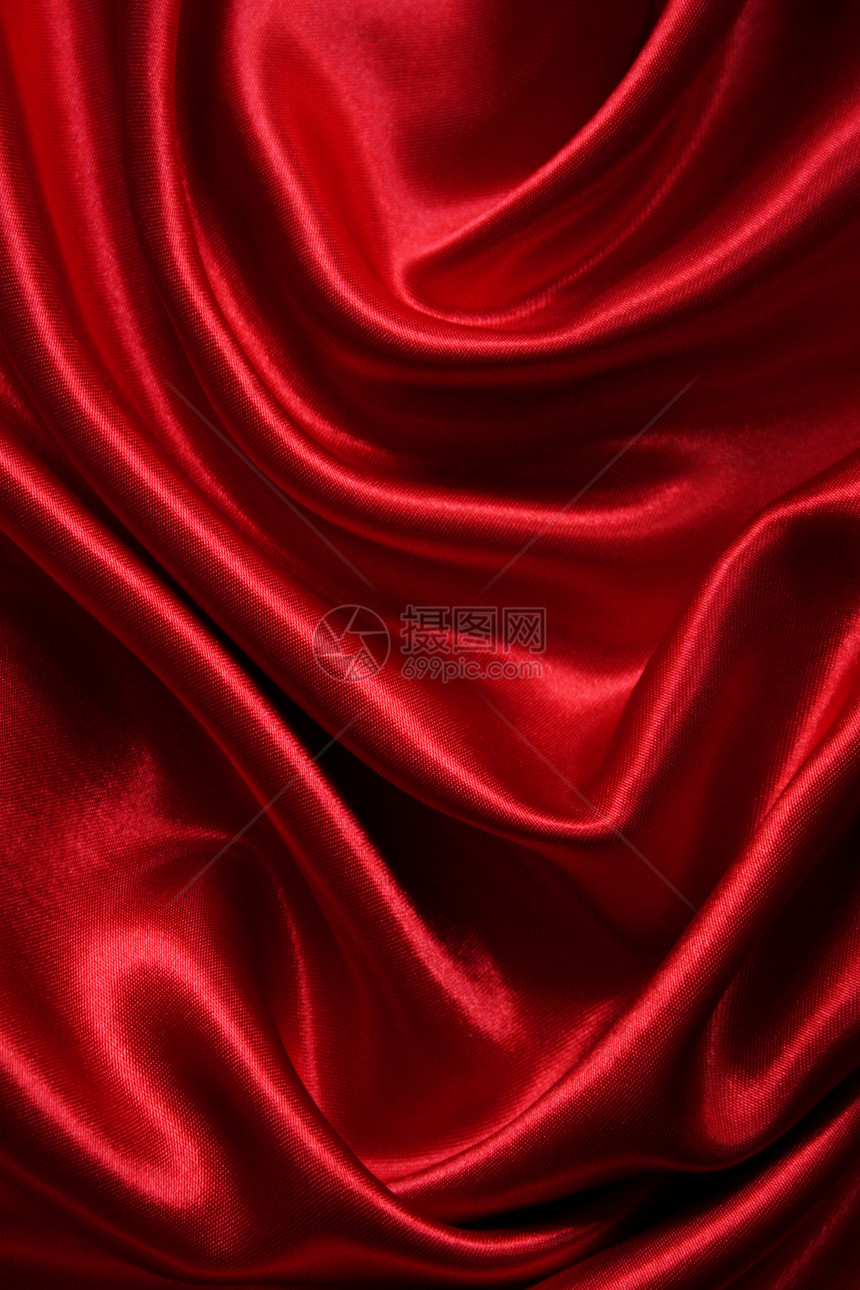 平滑优雅的红色丝绸可用作背景热情海浪材料柔软度曲线胭脂投标织物布料纺织品图片
