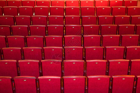 红椅子扶手椅礼堂休闲电影音乐会红色戏剧歌剧座位剧院背景图片
