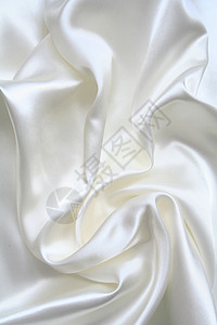 平滑优雅的白色丝绸作为背景涟漪布料纺织品银色材料曲线织物海浪投标折痕背景图片