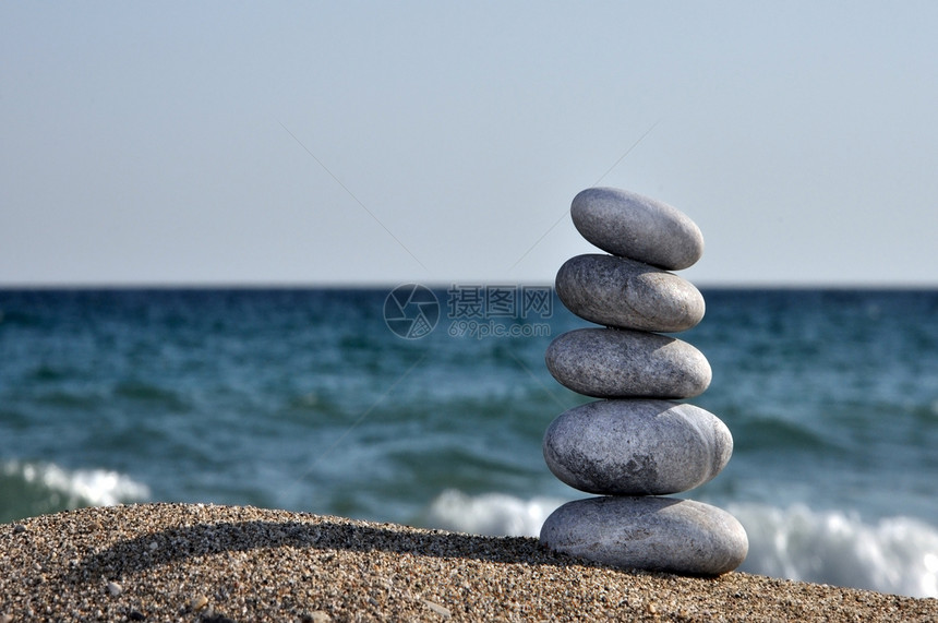 石头的堆积平衡岩石天空建筑旅行阳光卵石团体太阳海滩图片