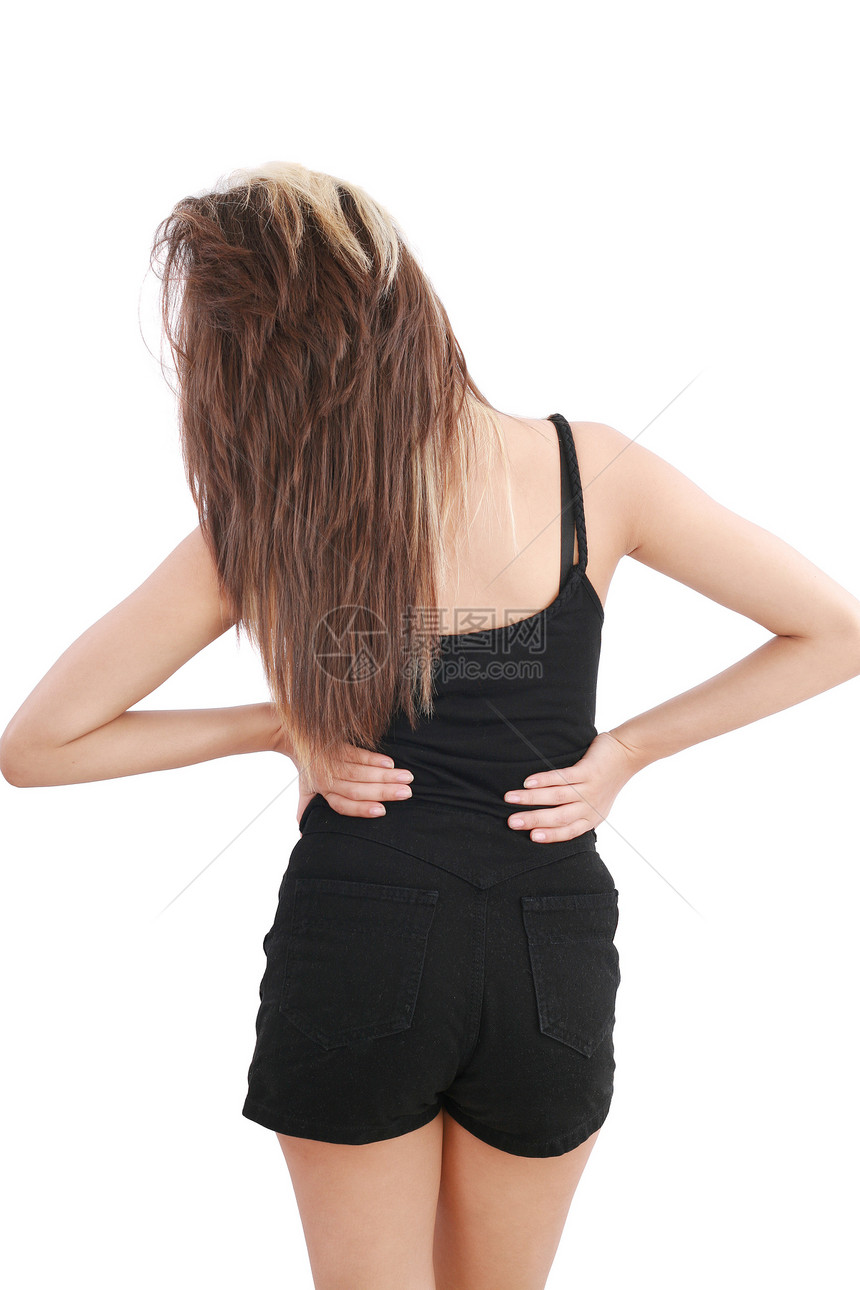 收紧遭受背痛的年轻女性图片