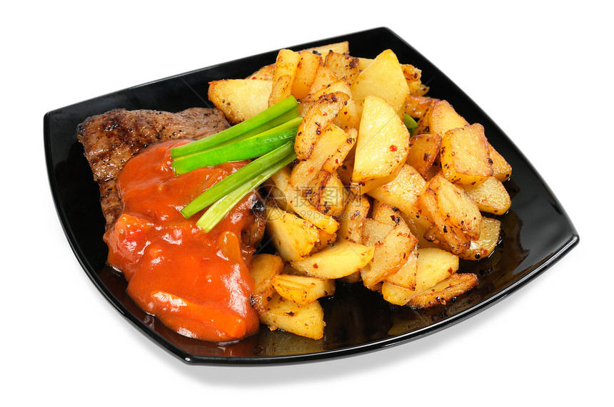 一块盘子上的灰肉和炸土豆食物牛扒油炸晚餐薯条烧烤土豆图片