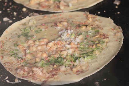 锅上日日食烹饪猪肉海藻细绳食物特产乌贼地区饼子高清图片