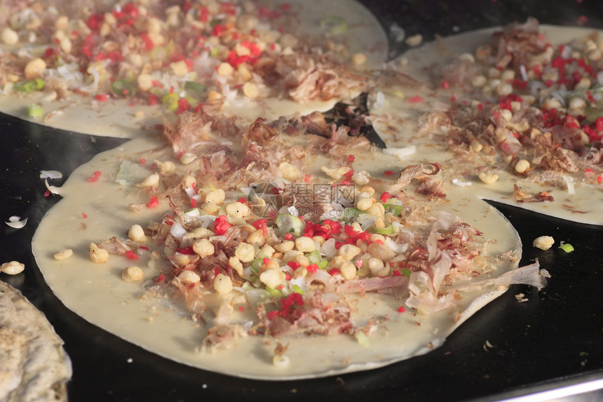 锅上日日食烹饪乌贼饼子地区海藻细绳猪肉特产食物图片