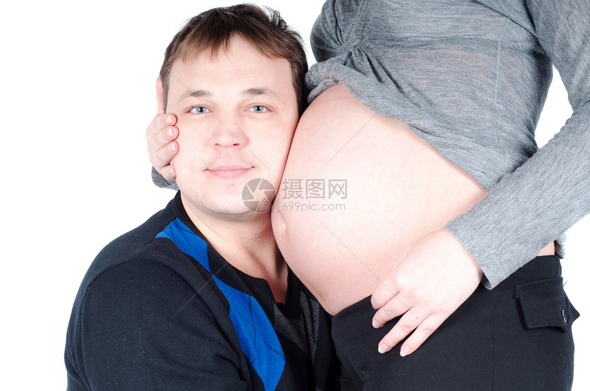 A 孕妇及其丈夫妻子母性父母女孩男人女性女士父亲男性微笑图片