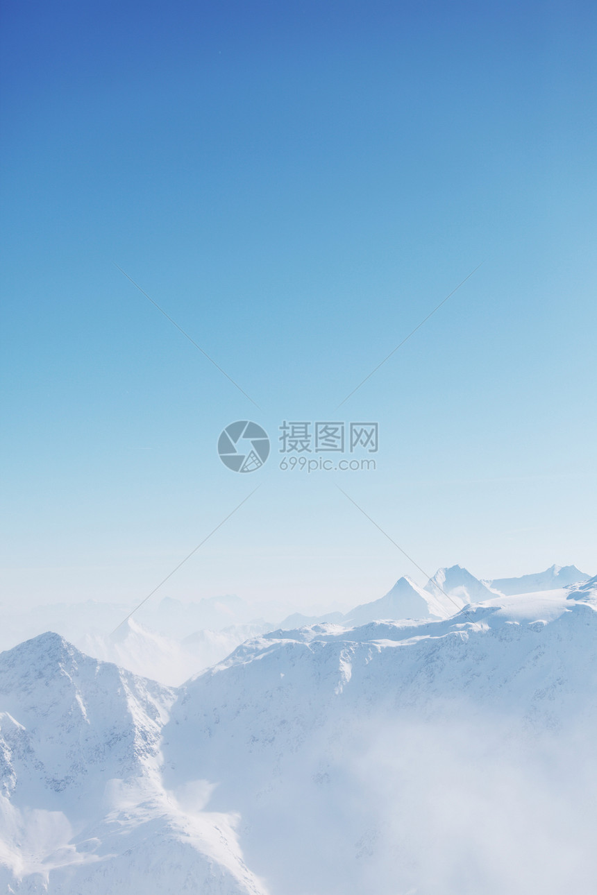 平面顶部单板远足暴风雪滑雪高山阳光天空爬坡旅游冻结图片