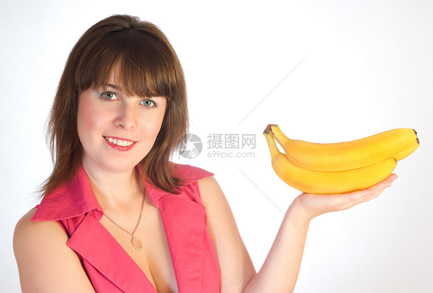 手拿着香蕉的美丽女孩果汁诱惑早餐成人女士裙子水果微笑快乐头发图片