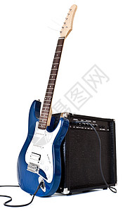 蓝色吉他电动吉他和扩音器乐器音乐会字符串白色成套细绳蓝色娱乐岩石照片背景