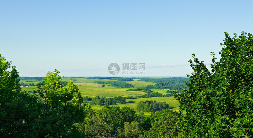 空中观测农村地貌场地丘陵青色爬坡蓝色叶子树叶照片晴天青菜图片