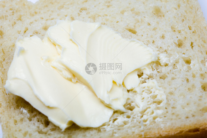 面包上的黄油食物产品诱惑小吃生产黄色传播奶制品早餐杂货图片