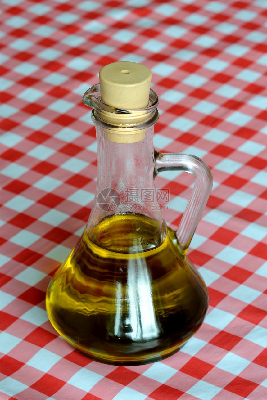 橄榄油白色黄色饮食瓶子蔬菜金子玻璃液体补给品食物图片
