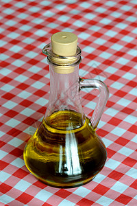 橄榄油白色黄色饮食瓶子蔬菜金子玻璃液体补给品食物背景图片