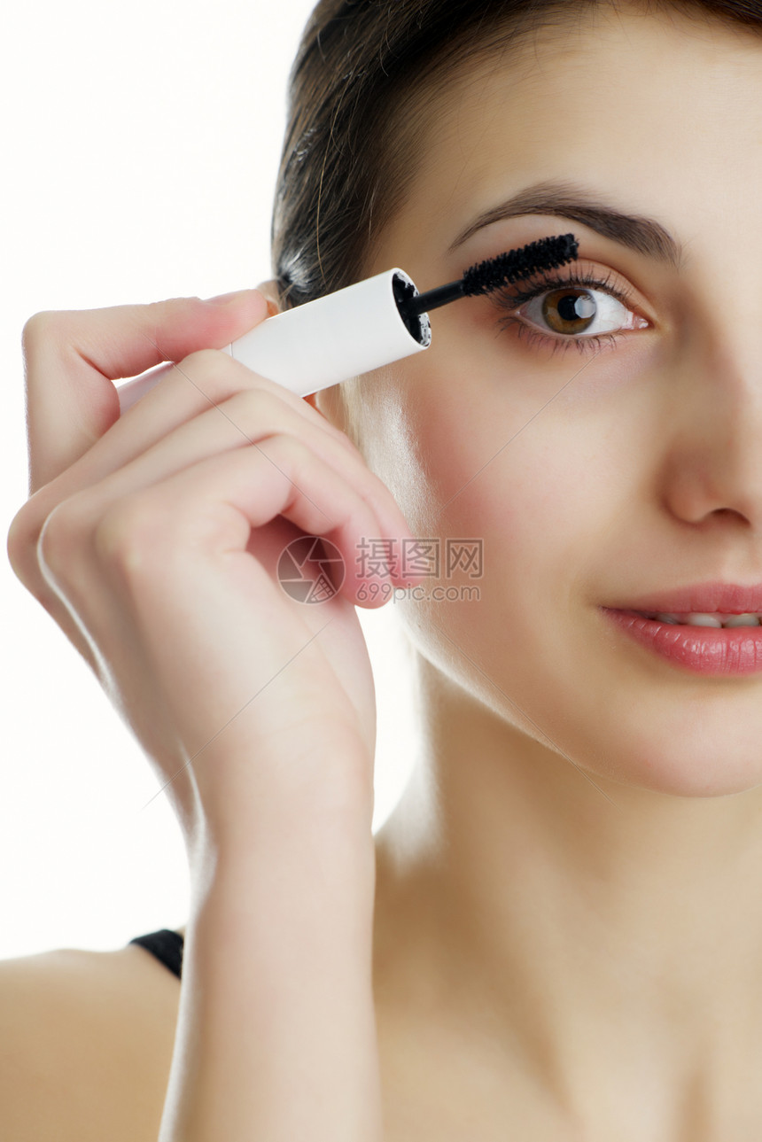 装饰治疗脸颊青年女士黑色眼睛手指睫毛膏皮肤头发图片
