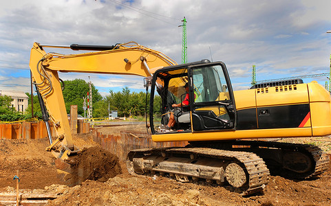 建设黄色挖掘机背景图片