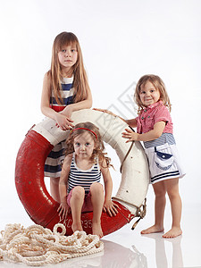 舰艇女孩们救生圈衣服冒充戏服楷模海军孩子们海滩工作室背景图片
