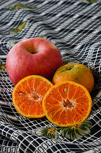 织物上的苹果和橙子背景图片