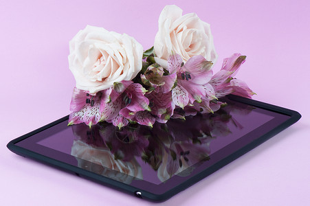 带花朵的黑色平板屏幕触摸屏导航互联网惊喜礼物笔记本电脑电话背景图片