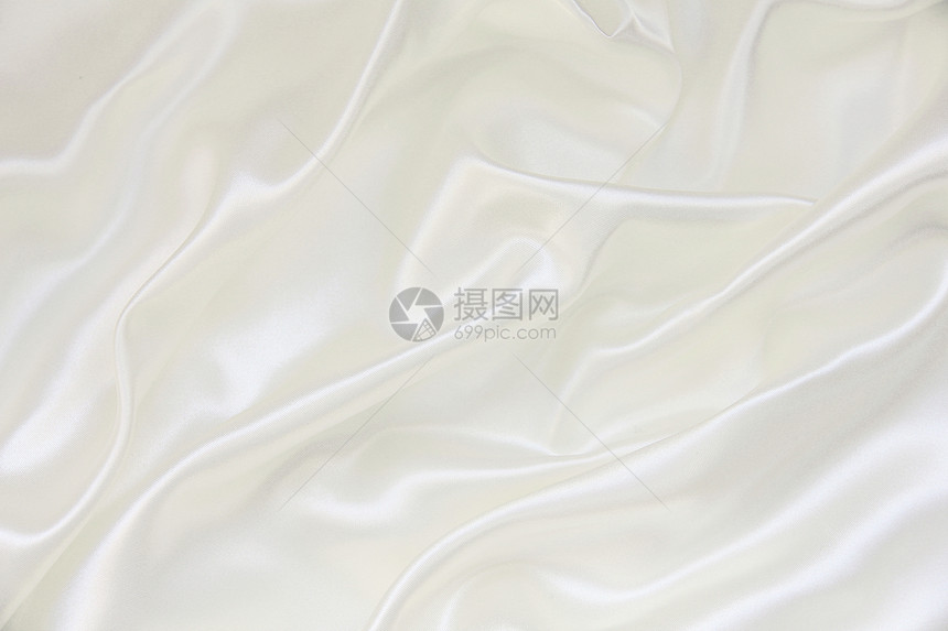平滑优雅的白色丝绸作为背景纺织品投标织物海浪婚礼涟漪感性折痕新娘布料图片