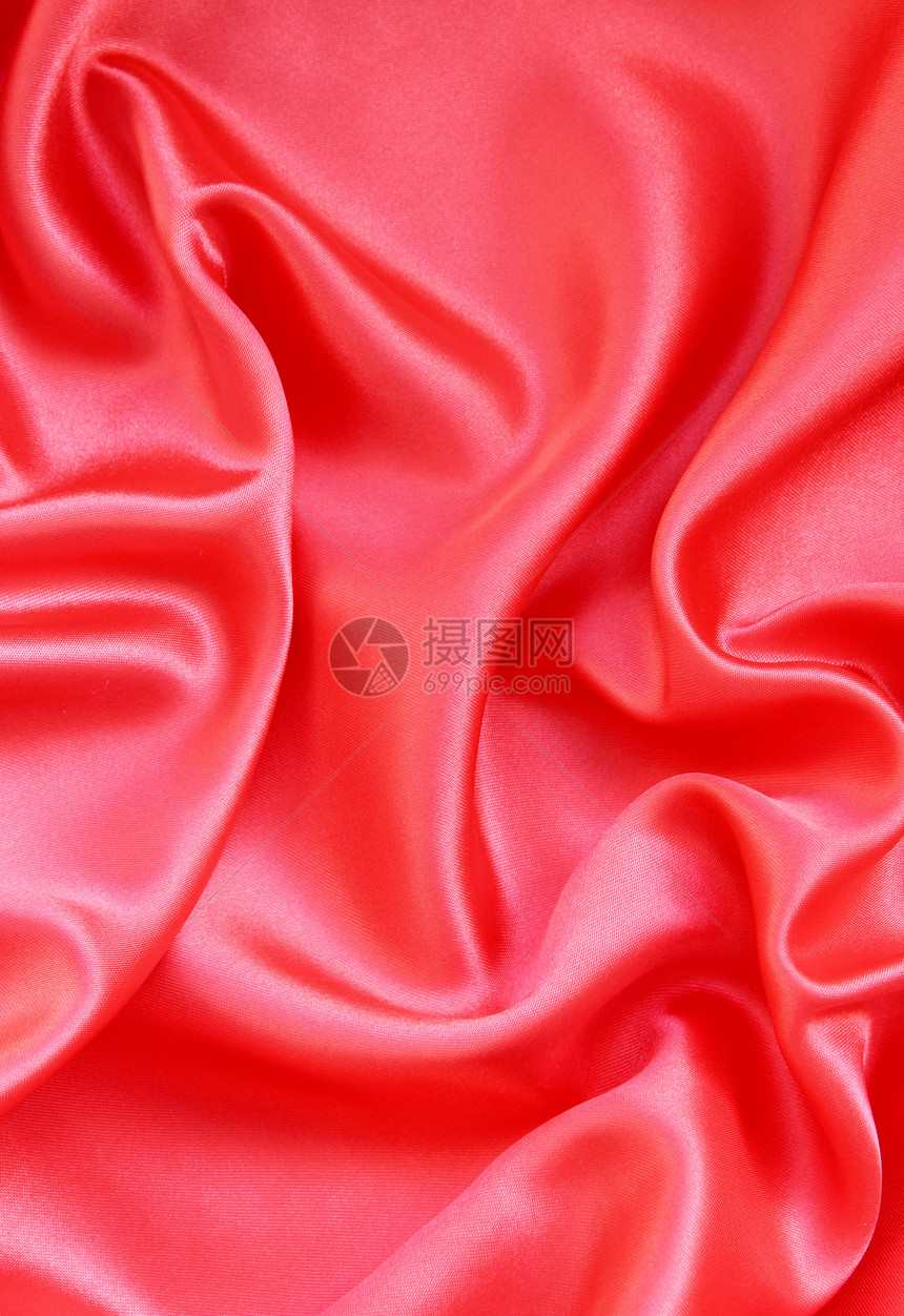 平滑的红丝绸背景粉色材料纺织品玫瑰红色织物窗帘柔软度热情曲线图片