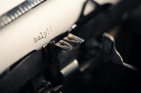 旧式打字机宏观复古黑色风格办公室古董意象写作机器背景图片
