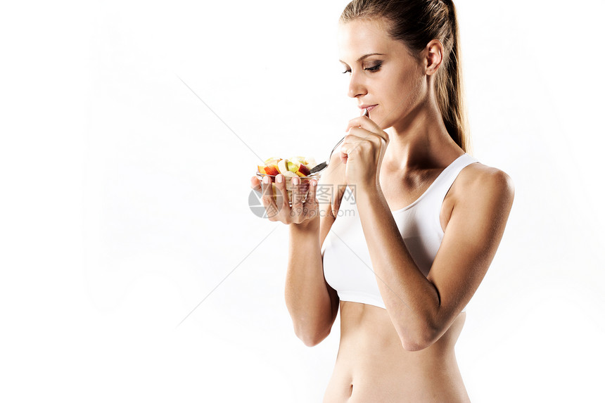 吃水果沙拉的年轻健康女子女性早餐魅力生活方式健康饮食成人青年福利快乐白色图片