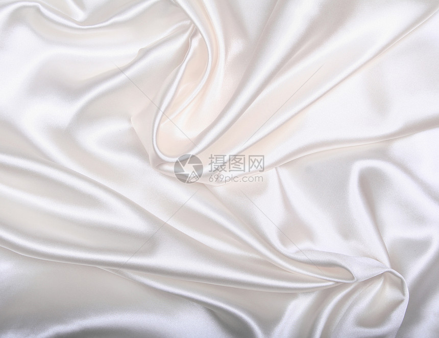 平滑优雅的白色丝绸作为背景婚礼涟漪材料衣服新娘曲线纺织品投标折痕版税图片