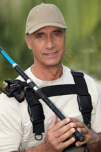 人鱼捕捞眼睛纺纱卷轴鼻子男人线轮肩带渔夫棒球帽工具背景图片
